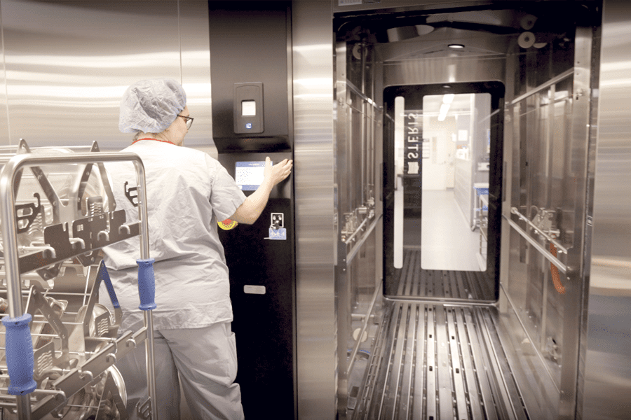 St. Mary's staff member operating the new surgical cart washer.