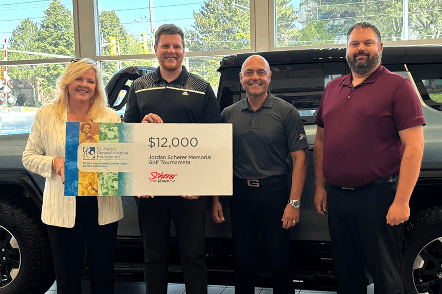 Susan Dusick, President and CEO, SMGH Foundation w/ the Scherer Chevrolet Buick GMC Ltd. team.